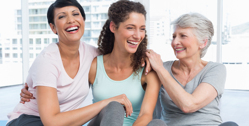 Women working with personal trainer at the gym