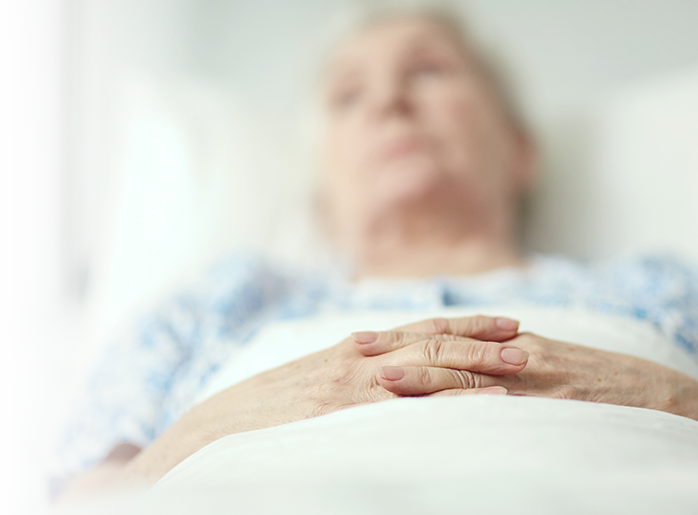 Woman in hospital bed