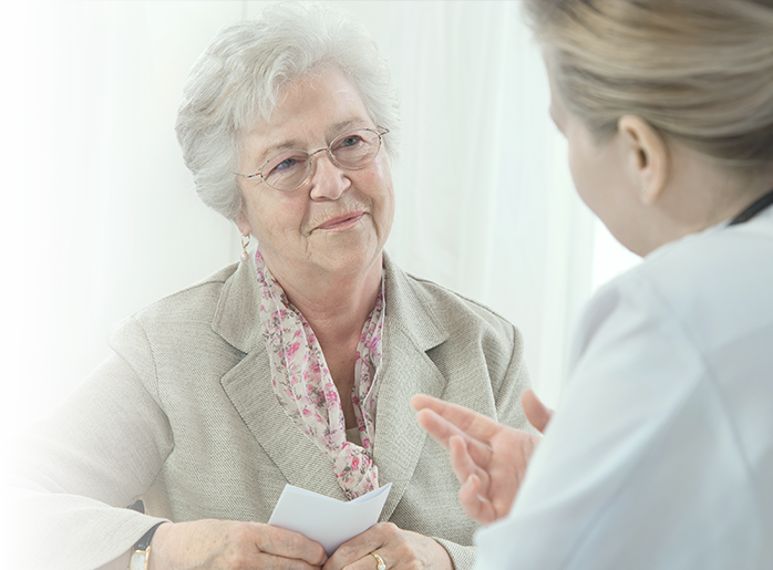 Woman talking with doctor