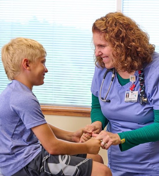 Nurse with pediatric patient